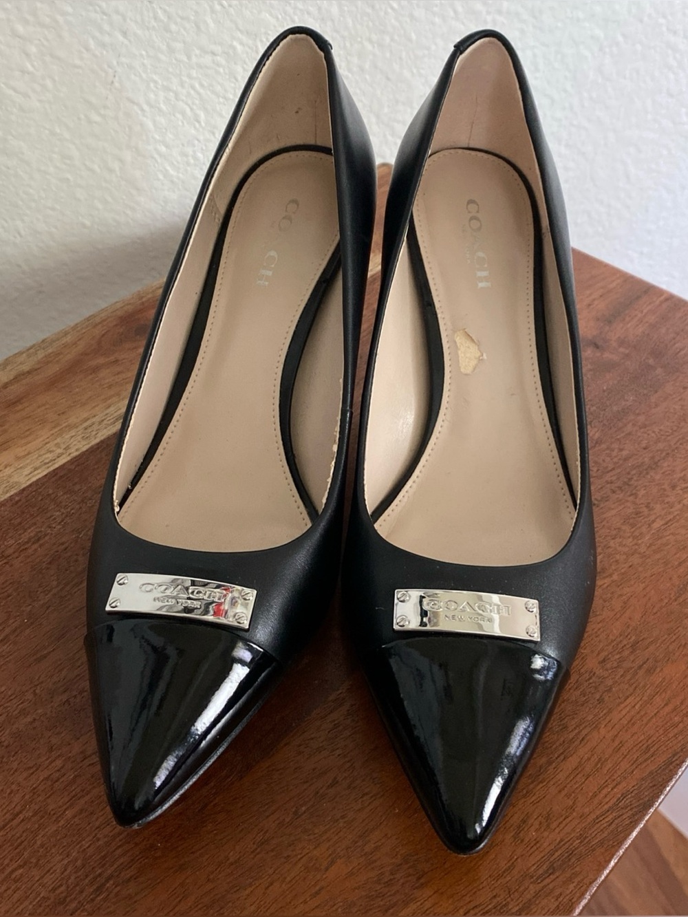 Coach Black Pointed Toe Leather Pumps with Logo Plaque size 6.5
